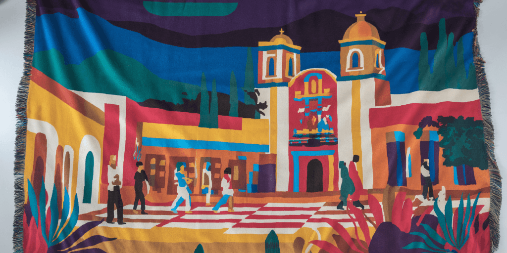 Mexican home decor throw blanket featuring a vibrant scene of a traditional village plaza, perfect for adding cultural flair to a living room.
